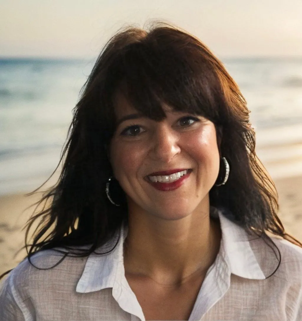 Woman standing in a sunlit wellness studio